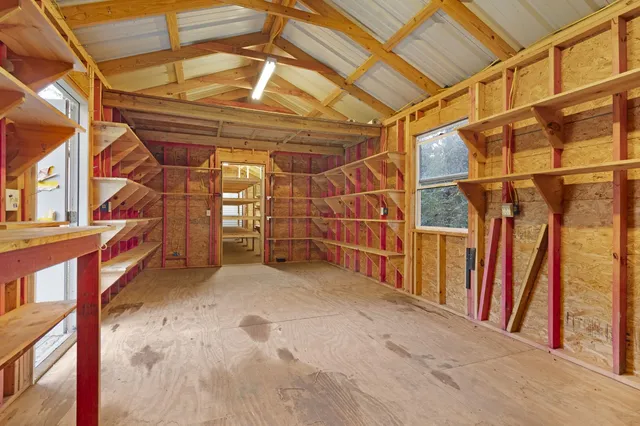 a view of an empty room with wooden walls