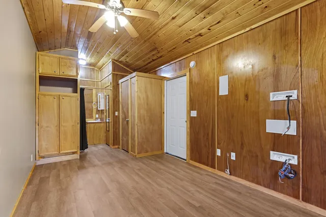 a view of hallway with wooden floor