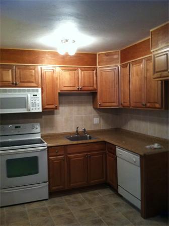 288 Swanson Road, Unit 203 Boxborough, MA 01719 - Photo 1 of 3 a kitchen with stainless steel appliances granite countertop a stove and a sink