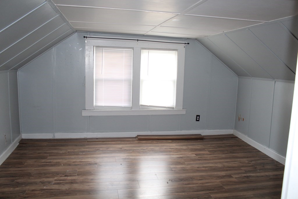 14 Richelieu Street Chicopee, MA 01020 - Photo 15 of 16 a room with wooden floor and a window