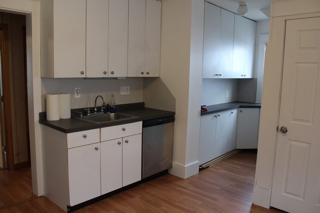 14 Richelieu Street Chicopee, MA 01020 - Photo 3 of 16 a kitchen with a sink and cabinets