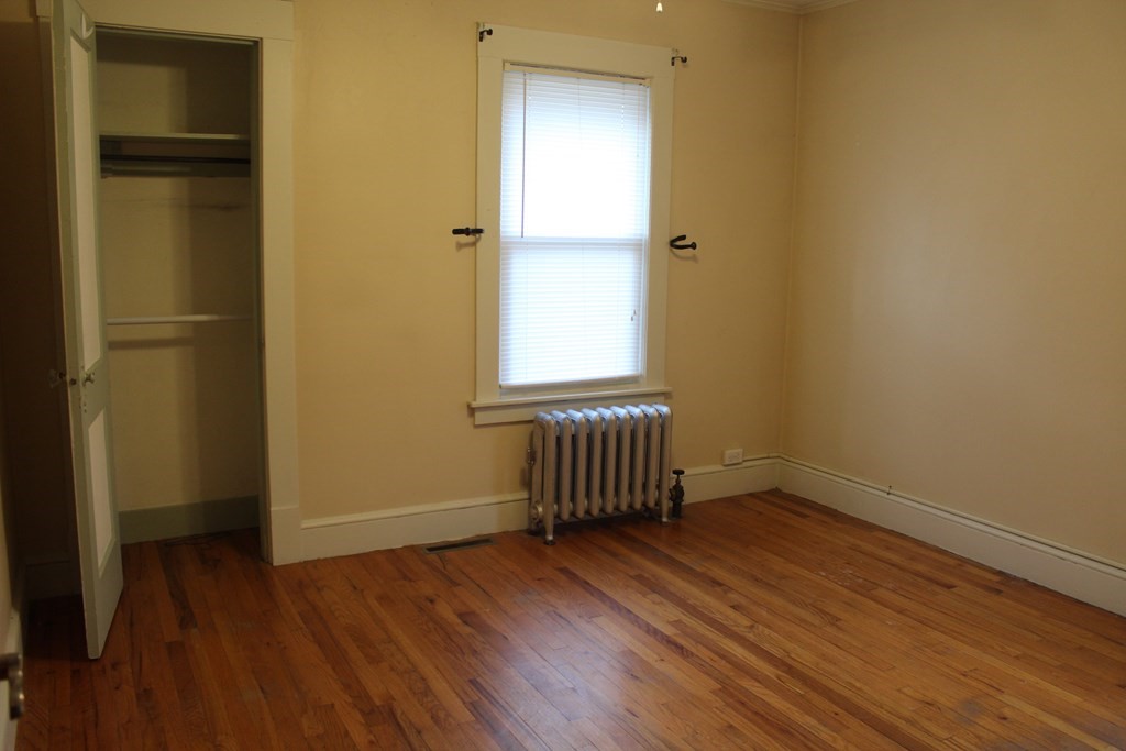 14 Richelieu Street Chicopee, MA 01020 - Photo 5 of 16 a view of empty room with wooden floor and fan