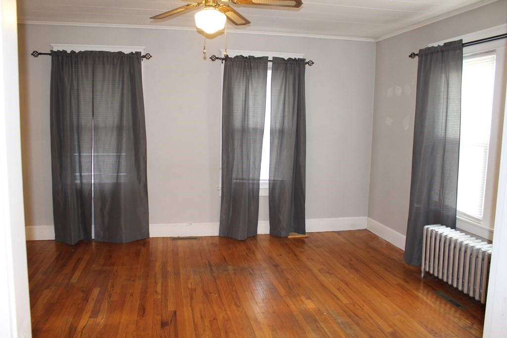 14 Richelieu Street Chicopee, MA 01020 - Photo 8 of 16 a view of empty room with wooden floor