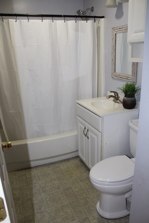 14 Richelieu Street Chicopee, MA 01020 - Photo 10 of 16 a bathroom with a sink a toilet and shower