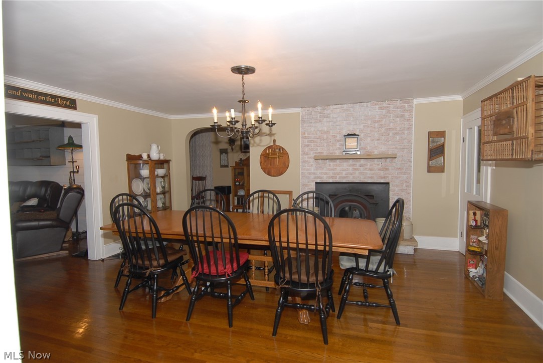 10255 North Morrison Road Dresden, OH 43821 - Photo 3 of 30 Dining Room with Fireplace and Hardwood Floors