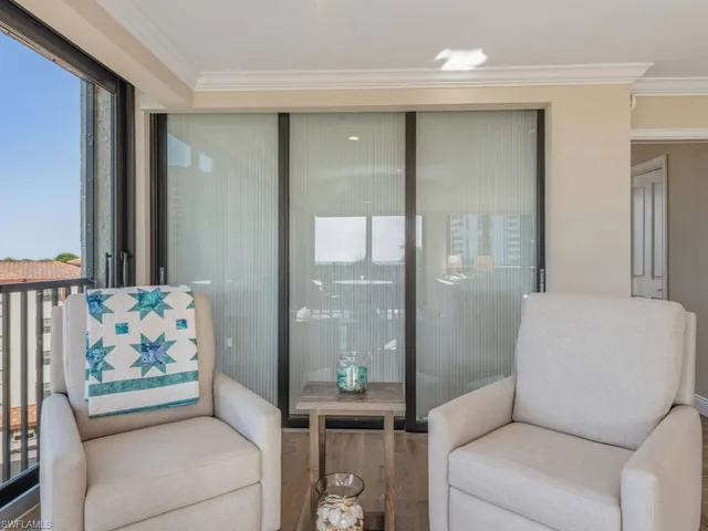 a living room with furniture and a gate