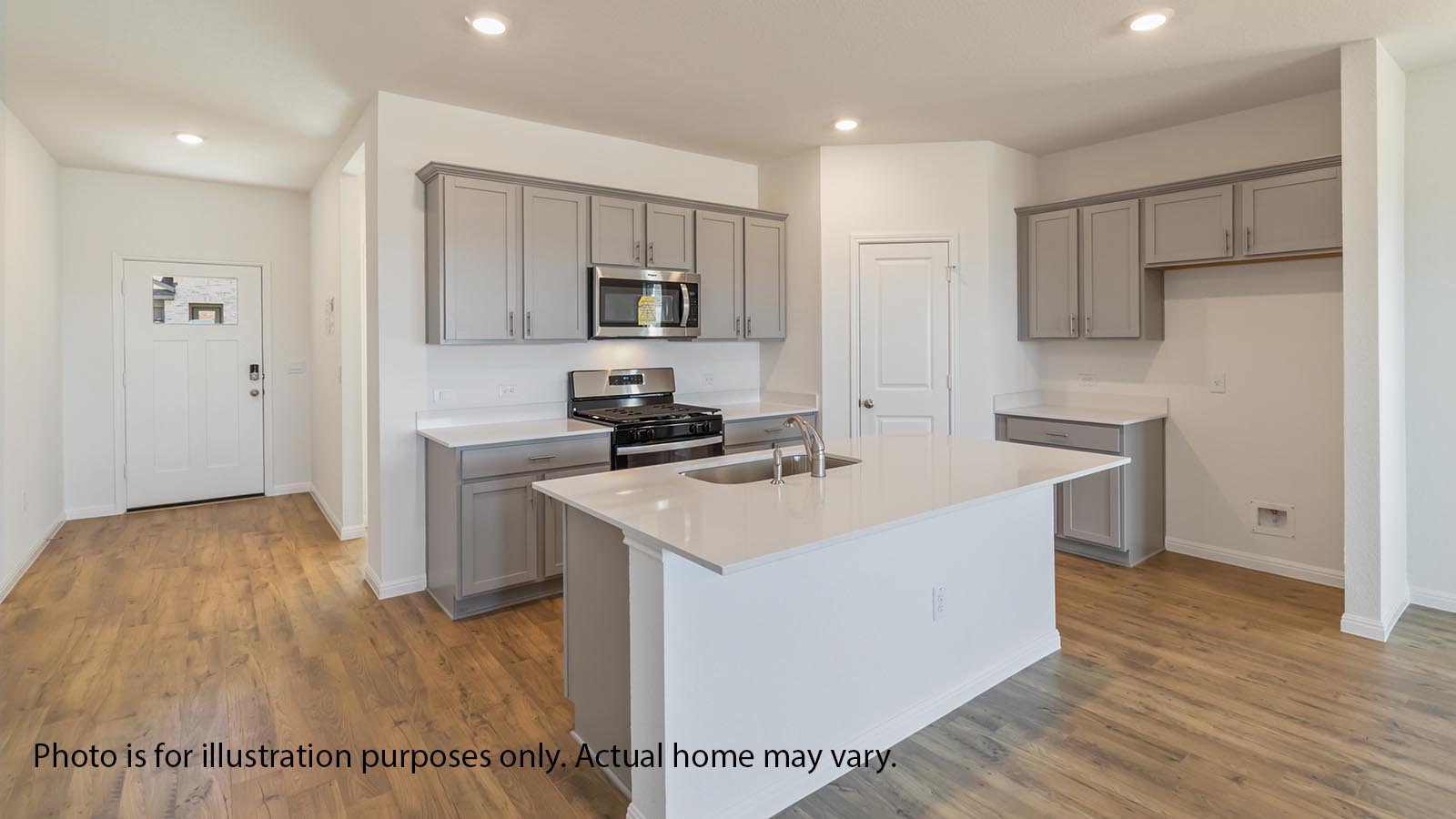 1825 Side Buster Trail Leander, TX 78641 - Photo 3 of 28 a kitchen with kitchen island a sink appliances and cabinets