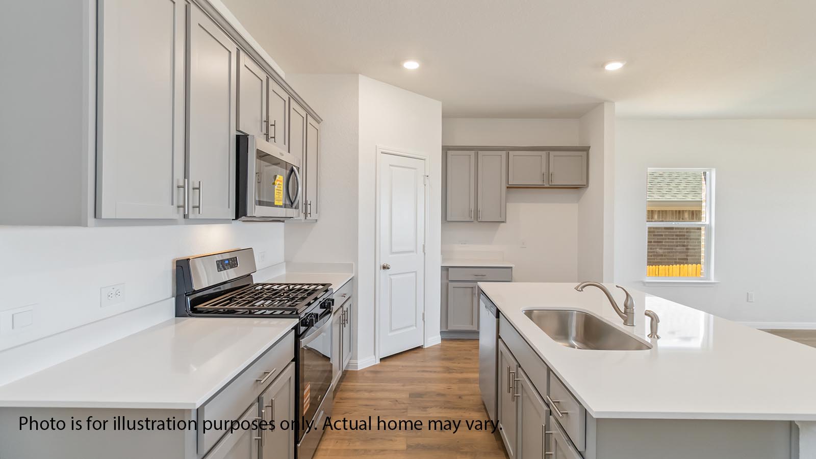 1825 Side Buster Trail Leander, TX 78641 - Photo 6 of 28 a kitchen with stainless steel appliances granite countertop a sink stove and refrigerator