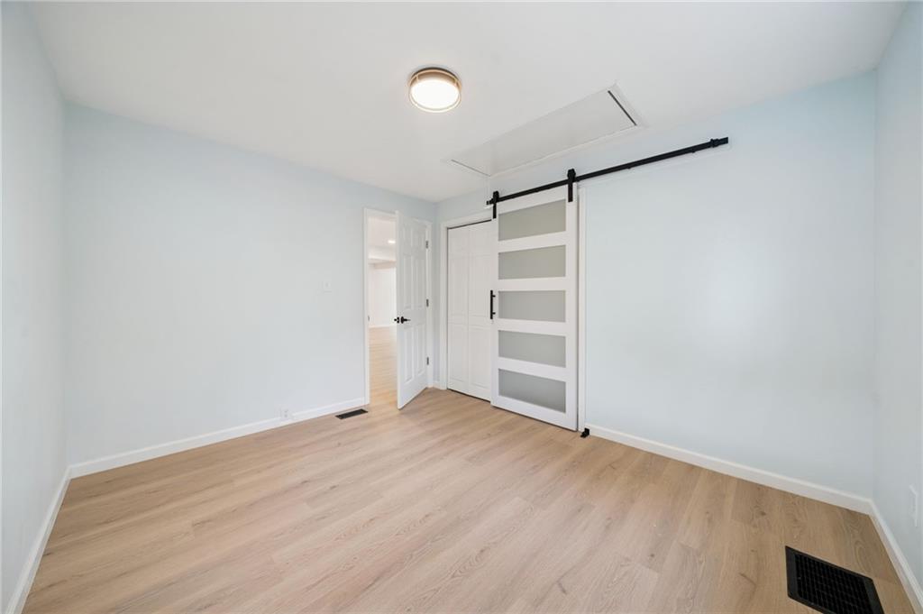 624 6th Street Mather, PA 15346 - Photo 18 of 26 a view of empty room with wooden floor