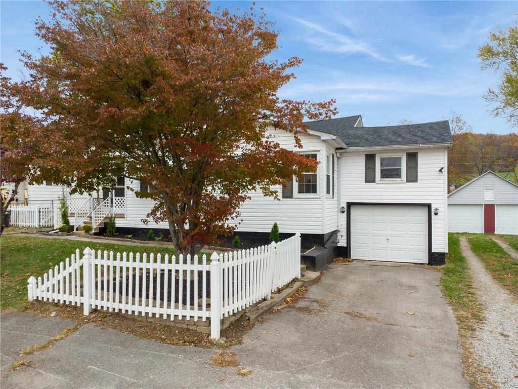 624 6th Street Mather, PA 15346 - Photo 2 of 26 a front view of a house with a garden