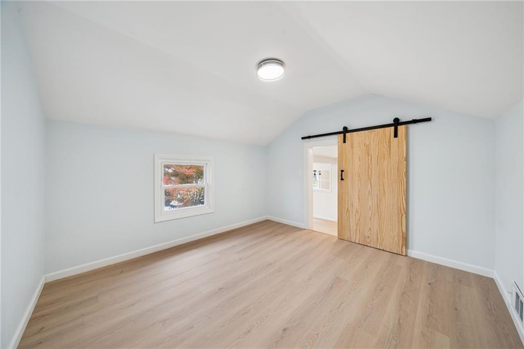 624 6th Street Mather, PA 15346 - Photo 21 of 26 wooden floor in an empty room with a window