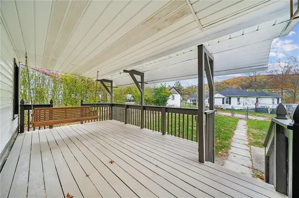 a view of balcony with wooden floor