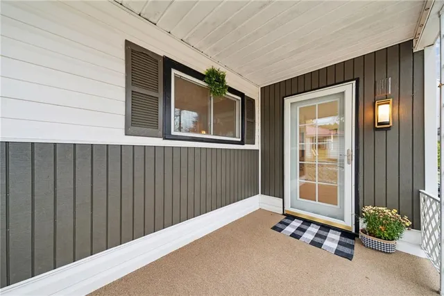 a view of an entryway with wooden walls