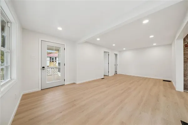 a view of an empty room with a window