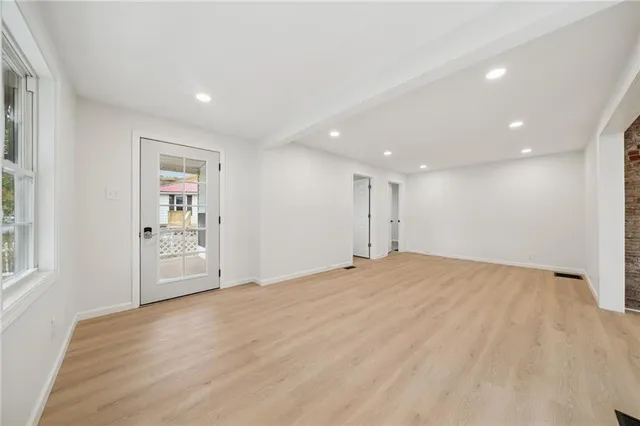 a view of an empty room with a window