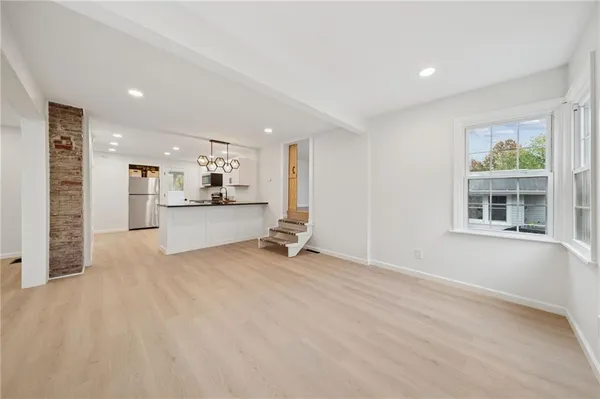 a view of a kitchen with furniture and a window
