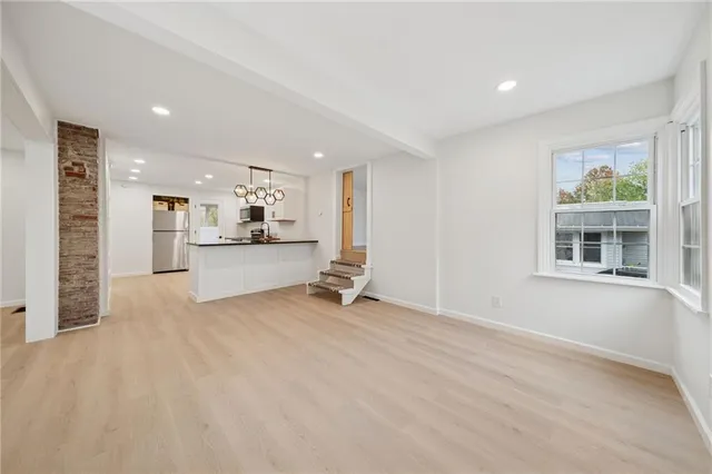 a view of a kitchen with furniture and a window