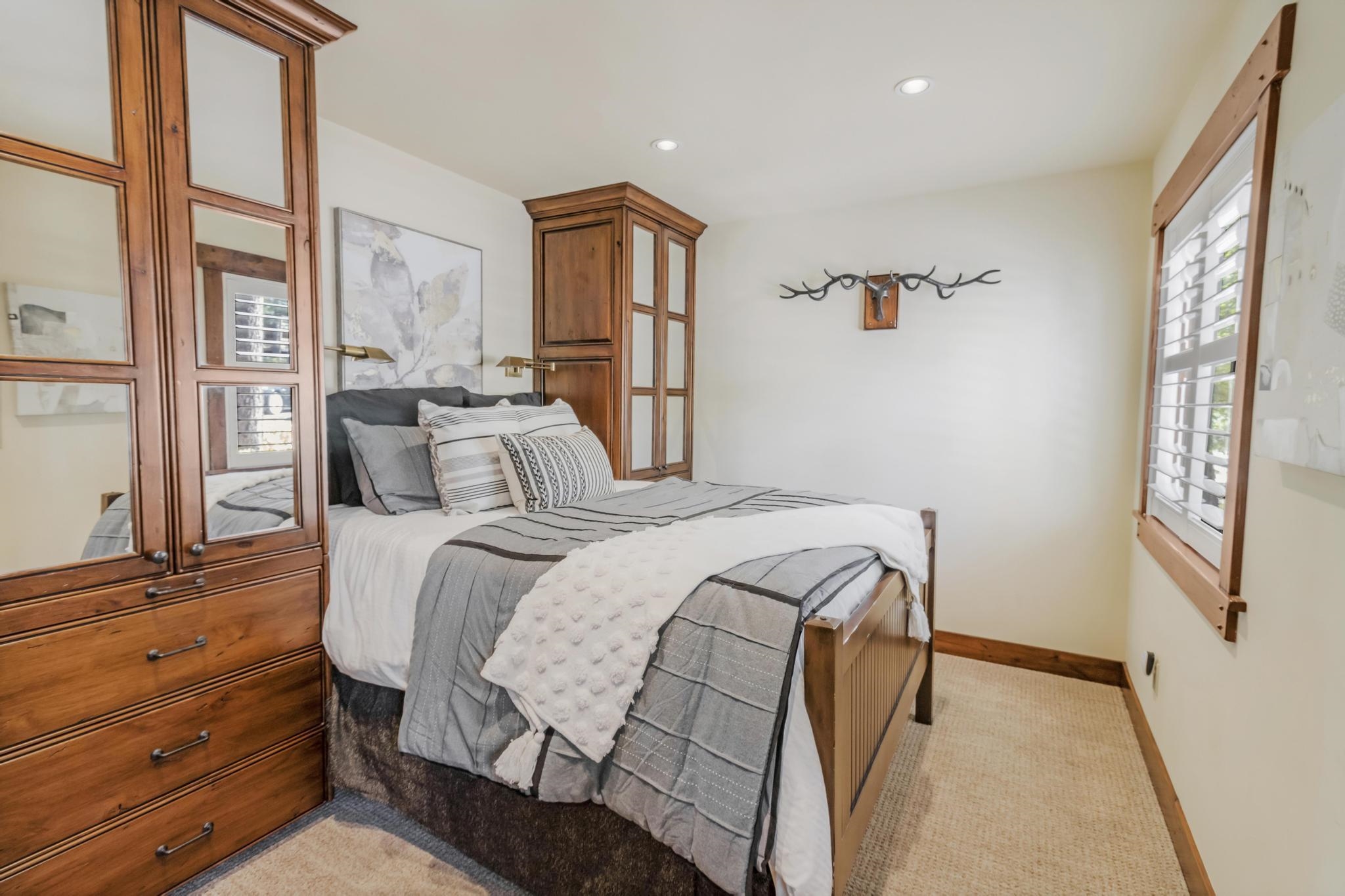 3035 Silver Strike Truckee, CA 96161 - Photo 11 of 20 a bedroom with a bed and a large window