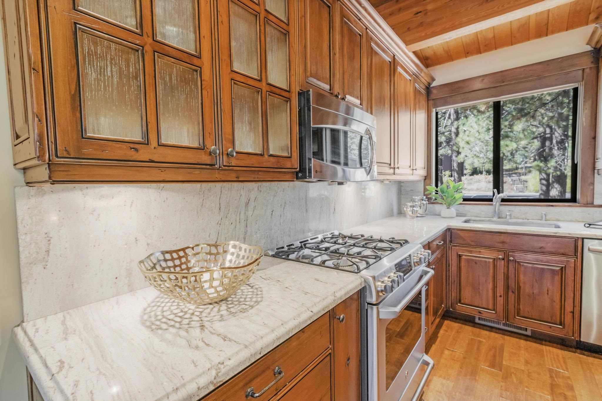 3035 Silver Strike Truckee, CA 96161 - Photo 5 of 20 a kitchen with stainless steel appliances granite countertop a sink stove and cabinets
