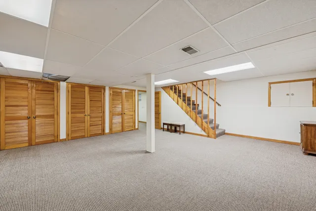 an empty room with furniture and white walls