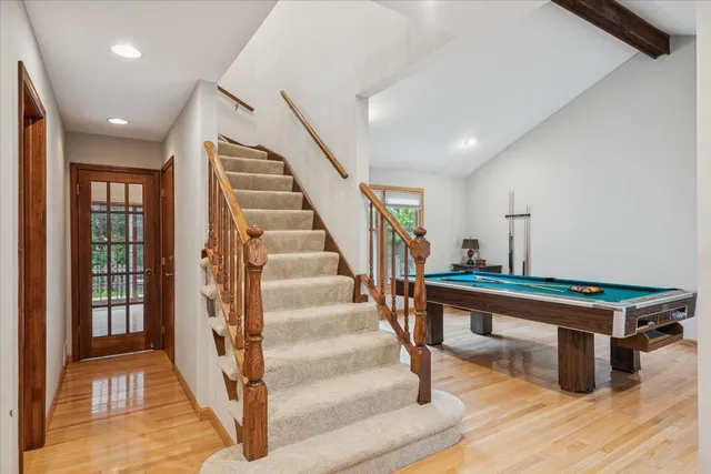 a view of entryway livingroom and hall with wooden floor