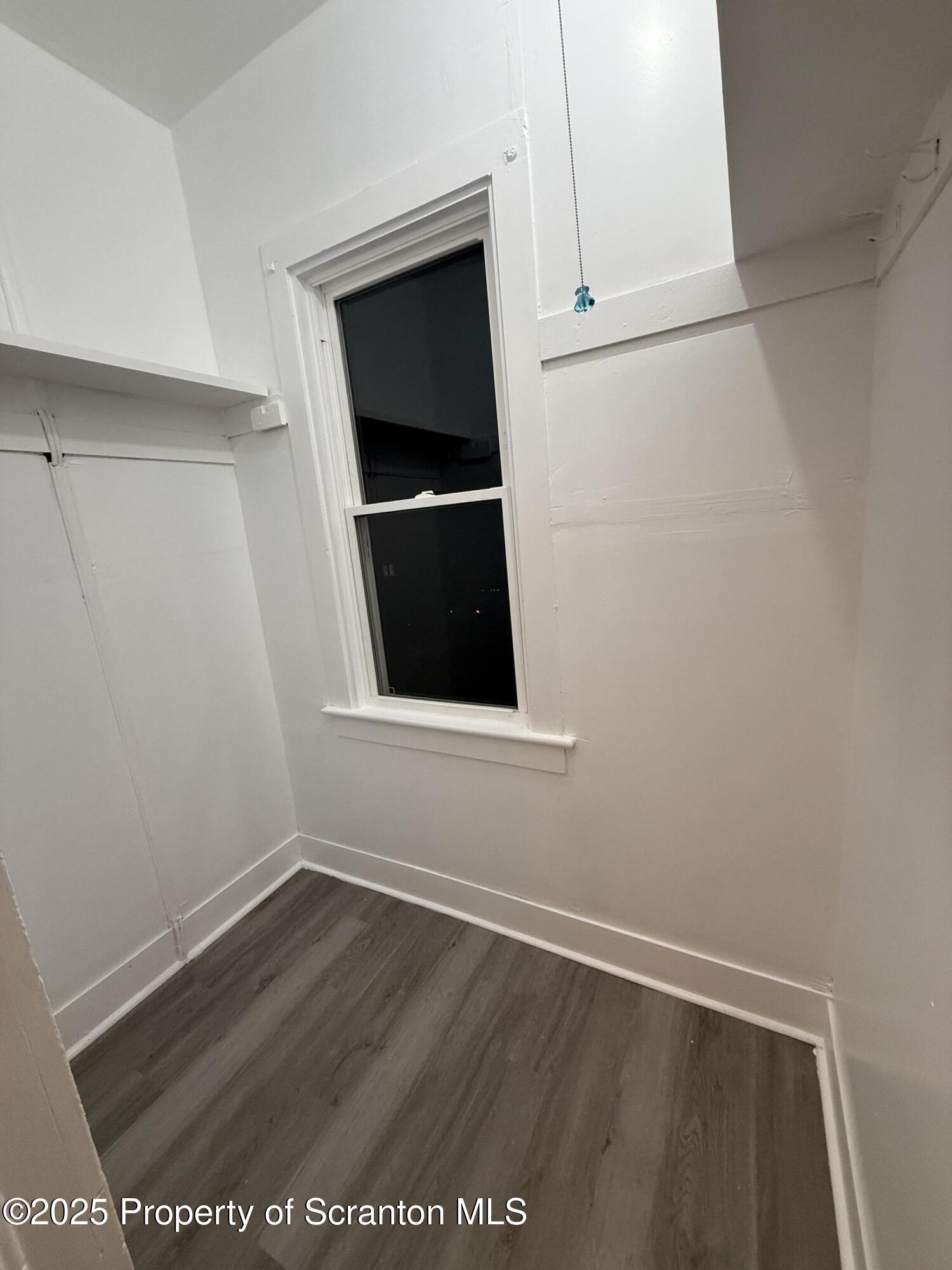 929 Stafford Avenue, Unit 2 Scranton, PA 18505 - Photo 6 of 8 a view of an empty room with wooden floor and closet