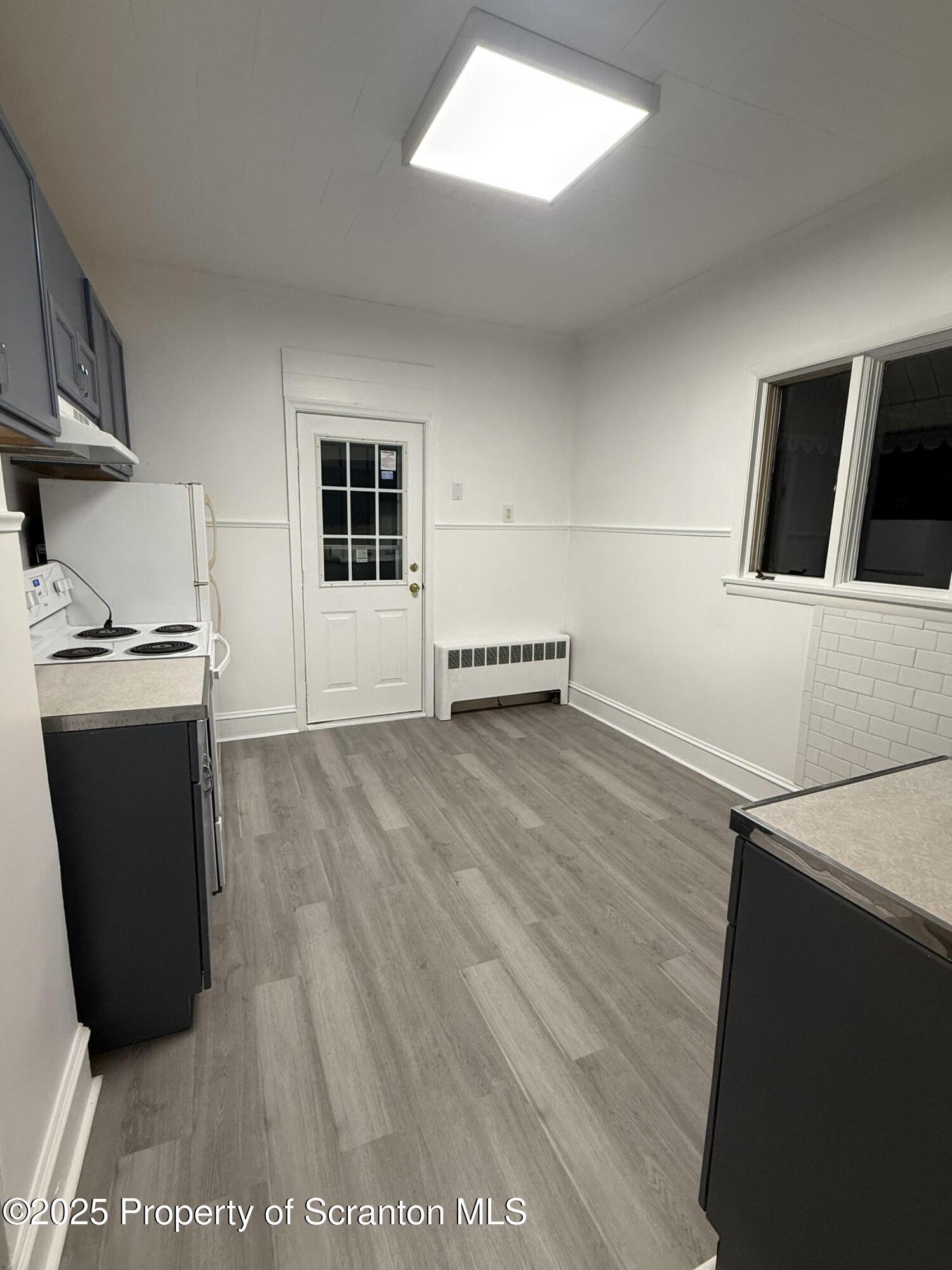 929 Stafford Avenue, Unit 2 Scranton, PA 18505 - Photo 8 of 8 a view of kitchen with stainless steel appliances a refrigerator and a stove
