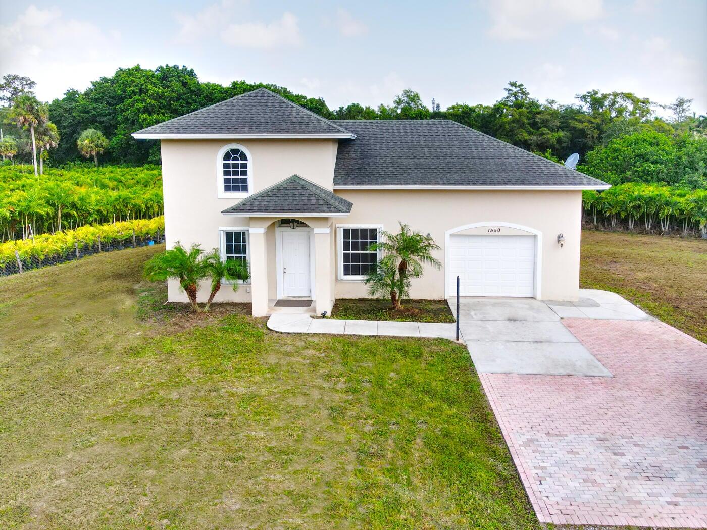 1550 C Road Loxahatchee Groves, FL 33470 - Photo 17 of 23 1550 C Rd front of home 2
