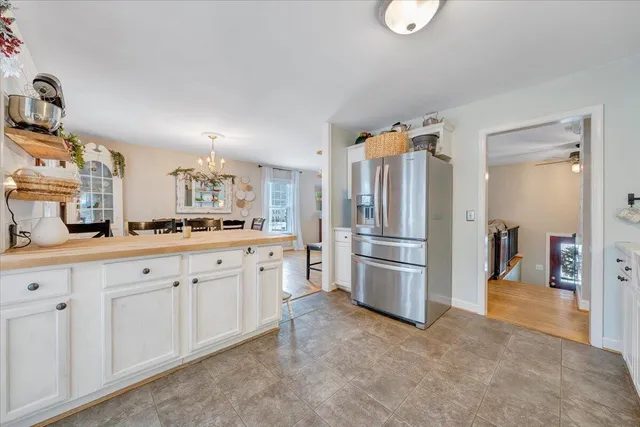 a kitchen with stainless steel appliances white cabinets and a stove