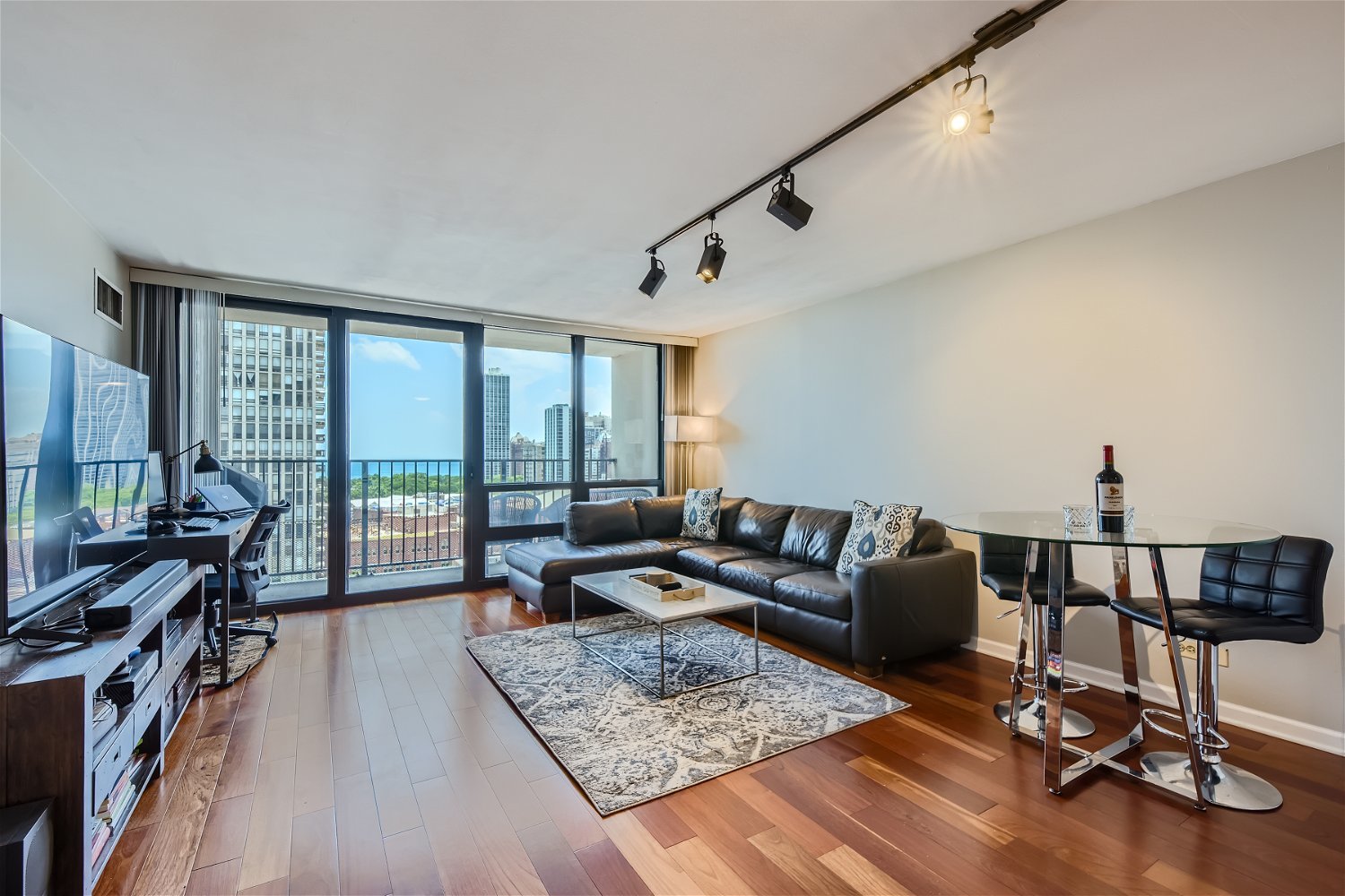 1636 North Wells Street, Unit 1505 Chicago, IL 60614 - Photo 2 of 21 a living room with furniture and a floor to ceiling window