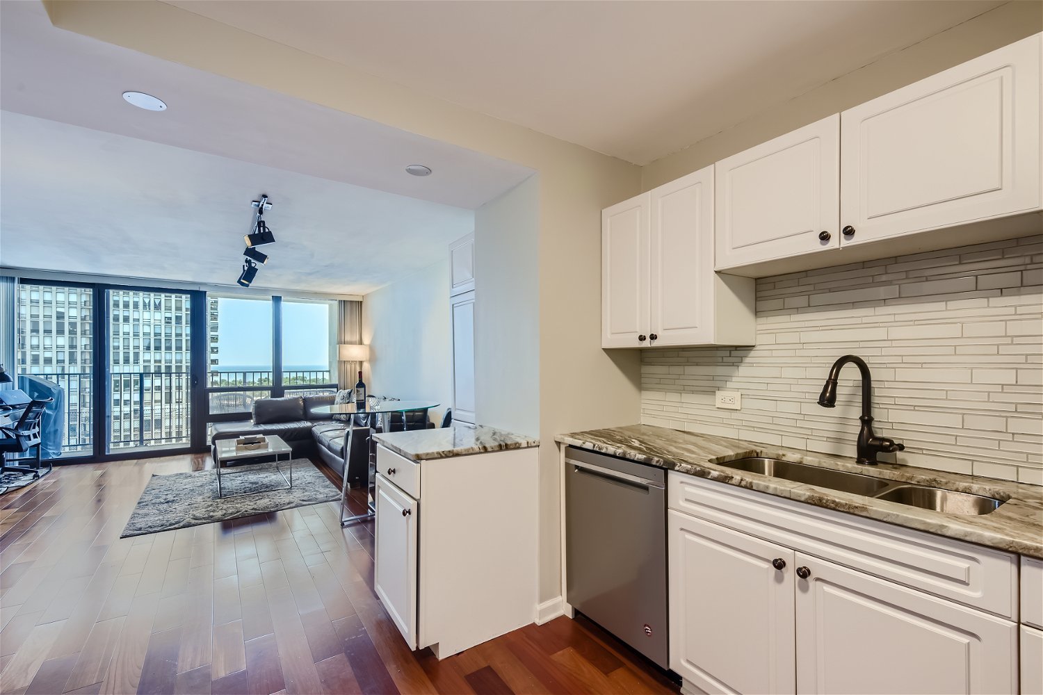1636 North Wells Street, Unit 1505 Chicago, IL 60614 - Photo 8 of 21 a kitchen with stainless steel appliances a sink a stove and cabinets