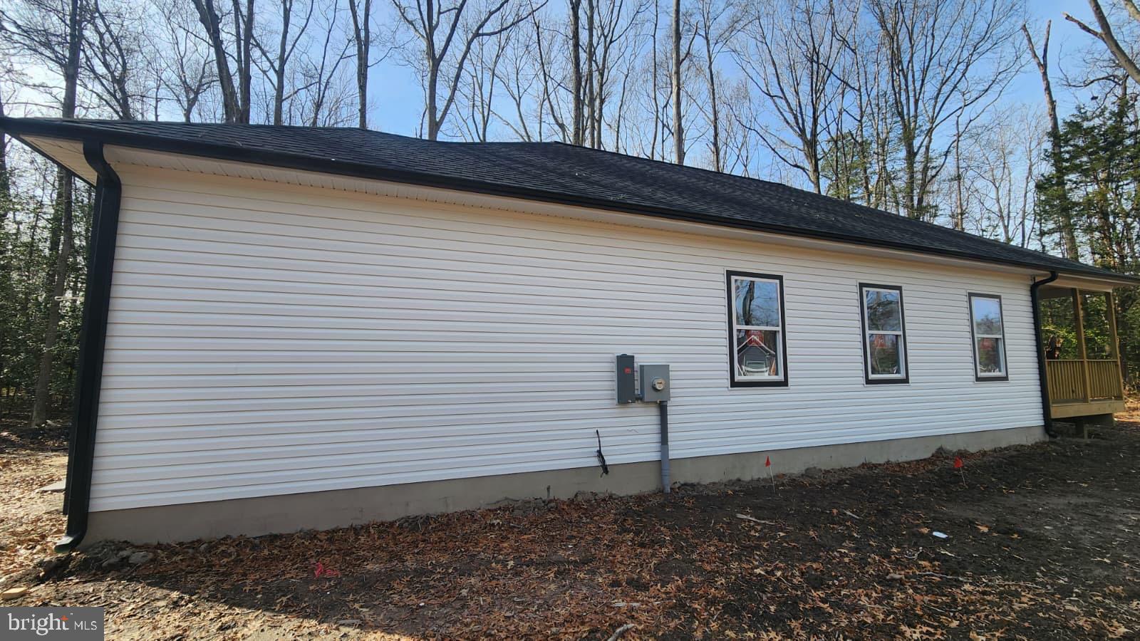 175 Rose Way Colonial Beach, VA 22443 - Photo 16 of 16 a view of a house with a yard