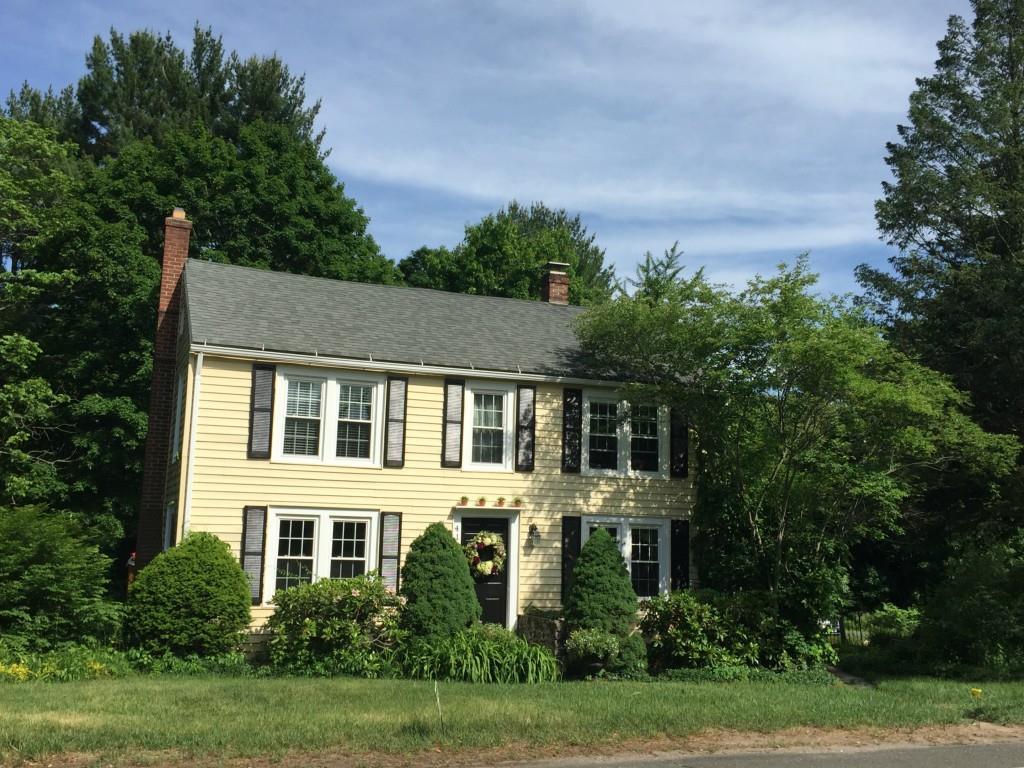 412 Bushy Hill Road Simsbury, CT 06070 - Photo 1 of 1 a front view of a house with a yard