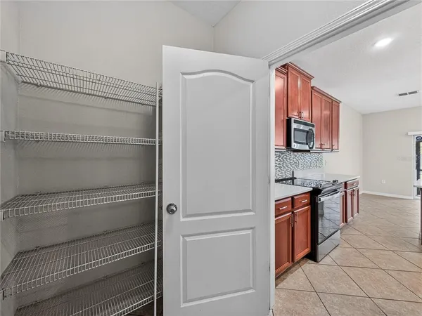 a kitchen with cabinets and appliances