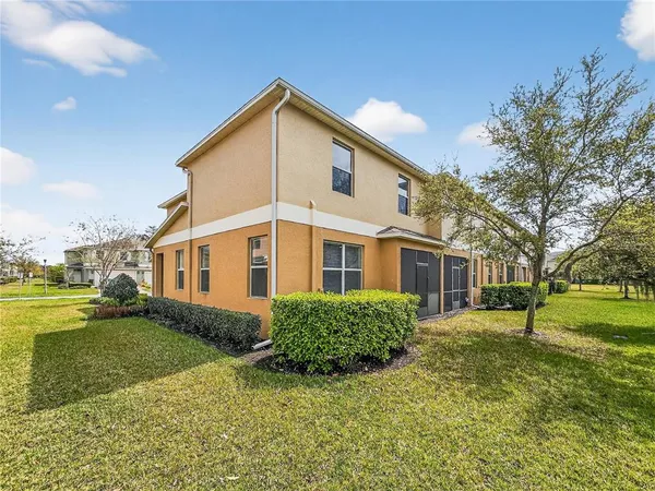 a view of a yard in front of a house with a big yard