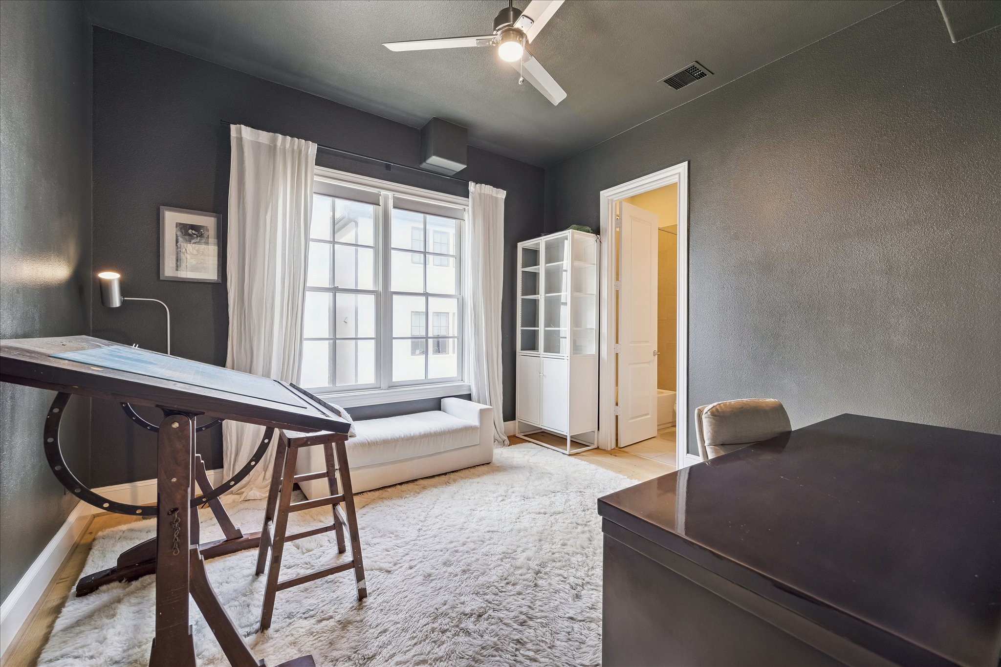 6108 Nicholas Grove Place Houston, TX 77055 - Photo 16 of 29 A secondary bedroom with a private ensuite bath completes the second floor. Currently utilized as an office and art studio, it offers exceptional flexibility for guests, work-from-home needs, or creative endeavors.