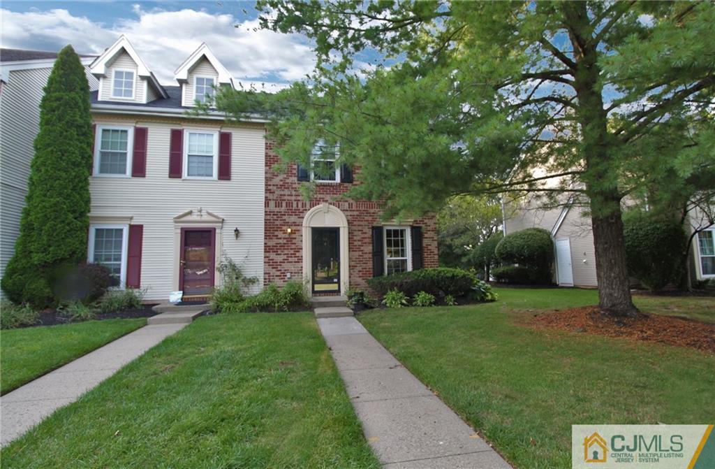 64 Goodwin Drive North Brunswick, NJ 08902 - Photo 1 of 25 a view of a white house with a yard and plants