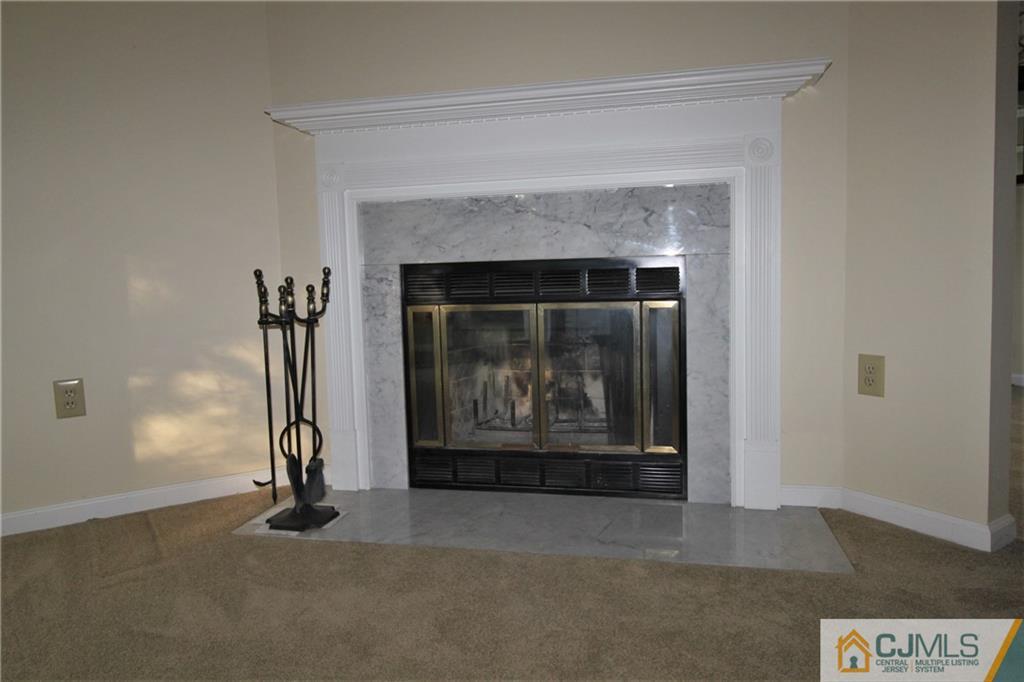 64 Goodwin Drive North Brunswick, NJ 08902 - Photo 11 of 25 a living room with a fireplace