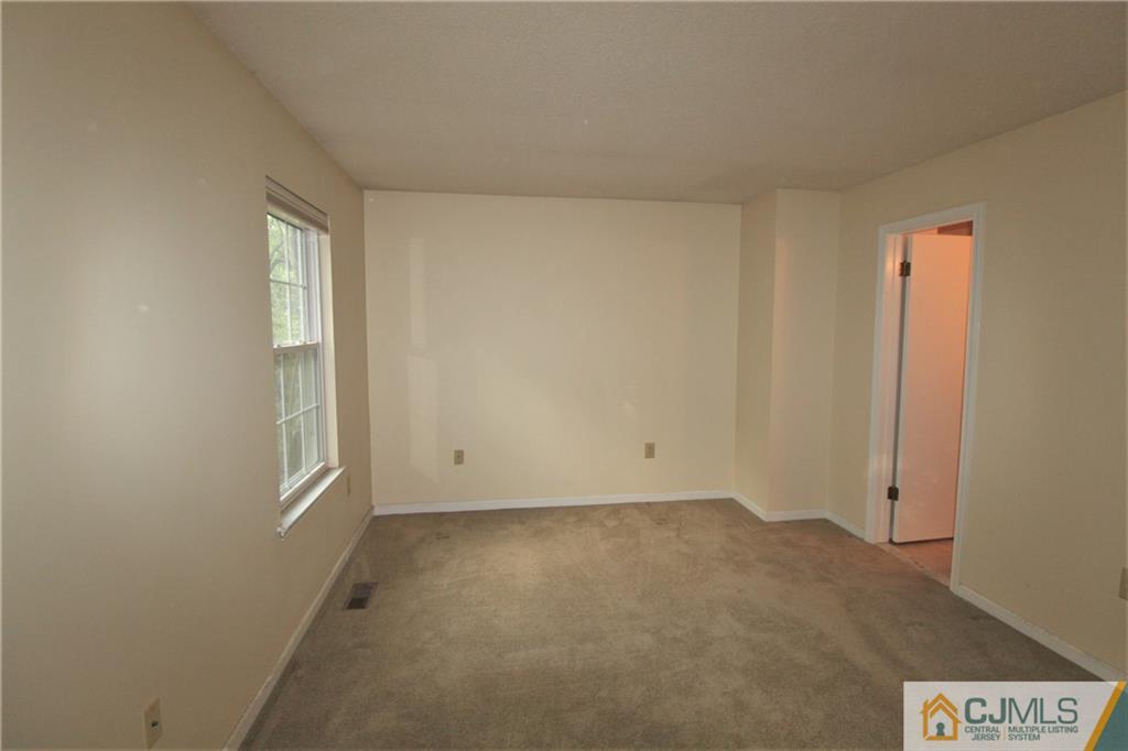 64 Goodwin Drive North Brunswick, NJ 08902 - Photo 16 of 25 a view of an empty room with a window