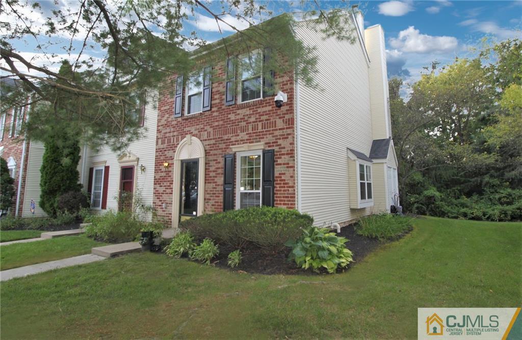 64 Goodwin Drive North Brunswick, NJ 08902 - Photo 2 of 25 a house with garden in front of it