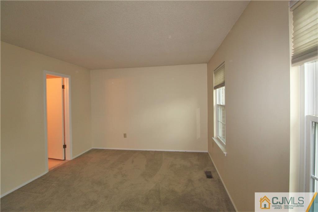 64 Goodwin Drive North Brunswick, NJ 08902 - Photo 21 of 25 an empty room with windows