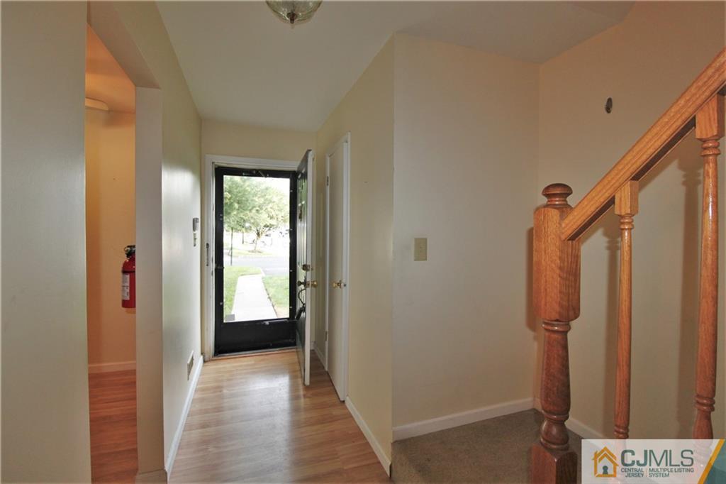 64 Goodwin Drive North Brunswick, NJ 08902 - Photo 3 of 25 a view of a hallway with wooden floor and closet