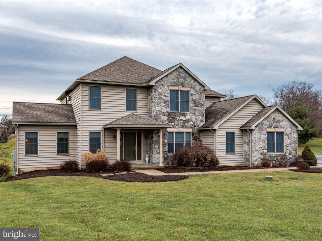 785 Rohen Ridge Drive Lititz, PA 17543 - Photo 1 of 36 a front view of a house with a garden