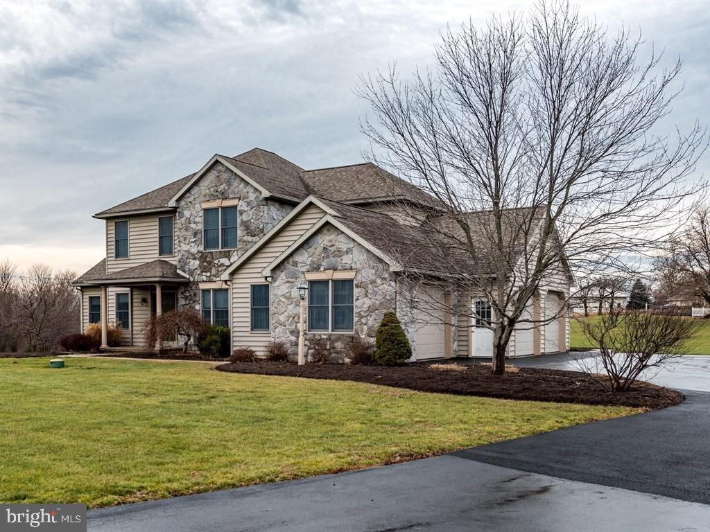785 Rohen Ridge Drive Lititz, PA 17543 - Photo 2 of 36 a front view of a house with garden