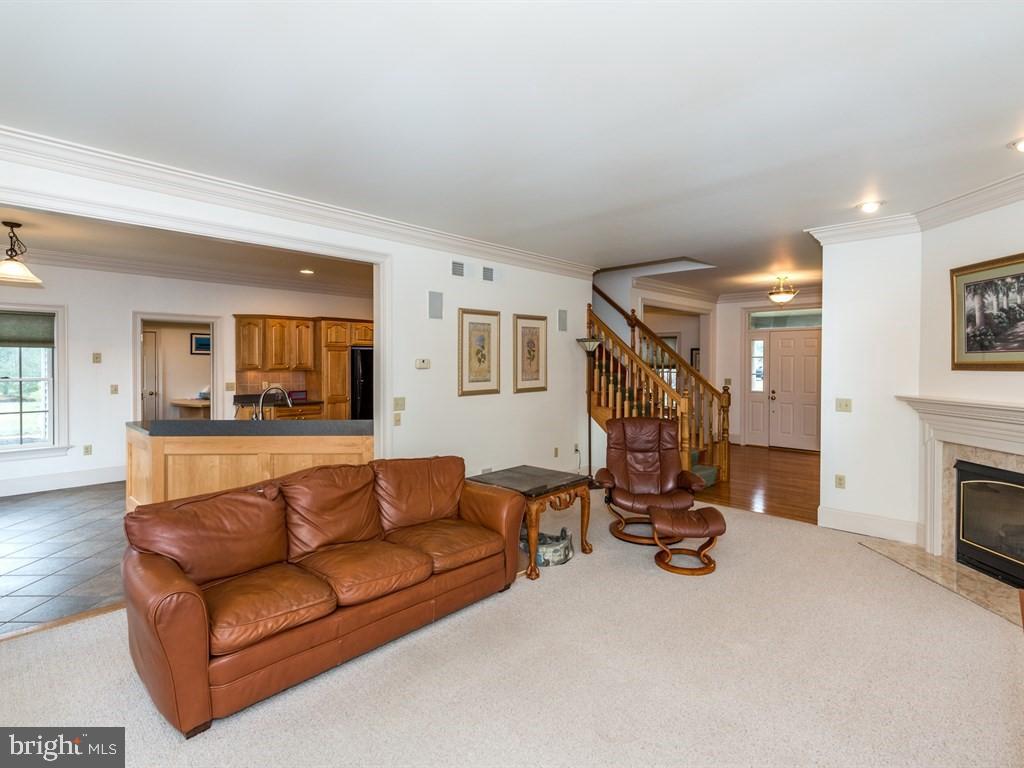 785 Rohen Ridge Drive Lititz, PA 17543 - Photo 12 of 36 a living room with furniture and a fireplace