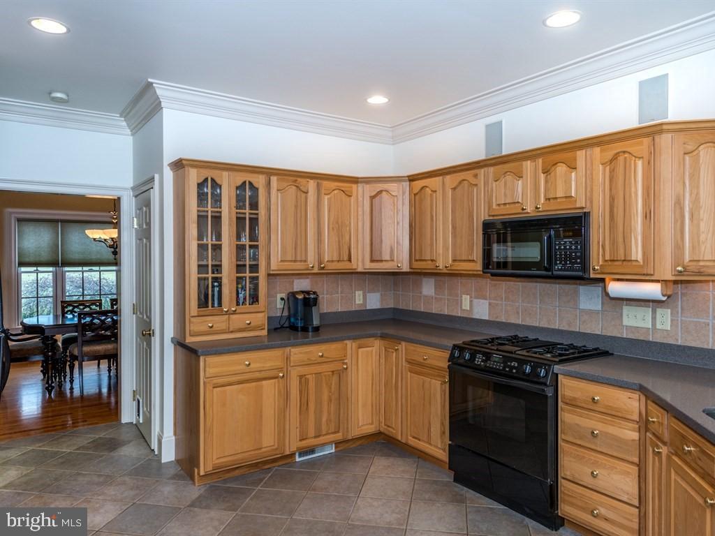 785 Rohen Ridge Drive Lititz, PA 17543 - Photo 14 of 36 a kitchen with stainless steel appliances granite countertop a stove and a sink