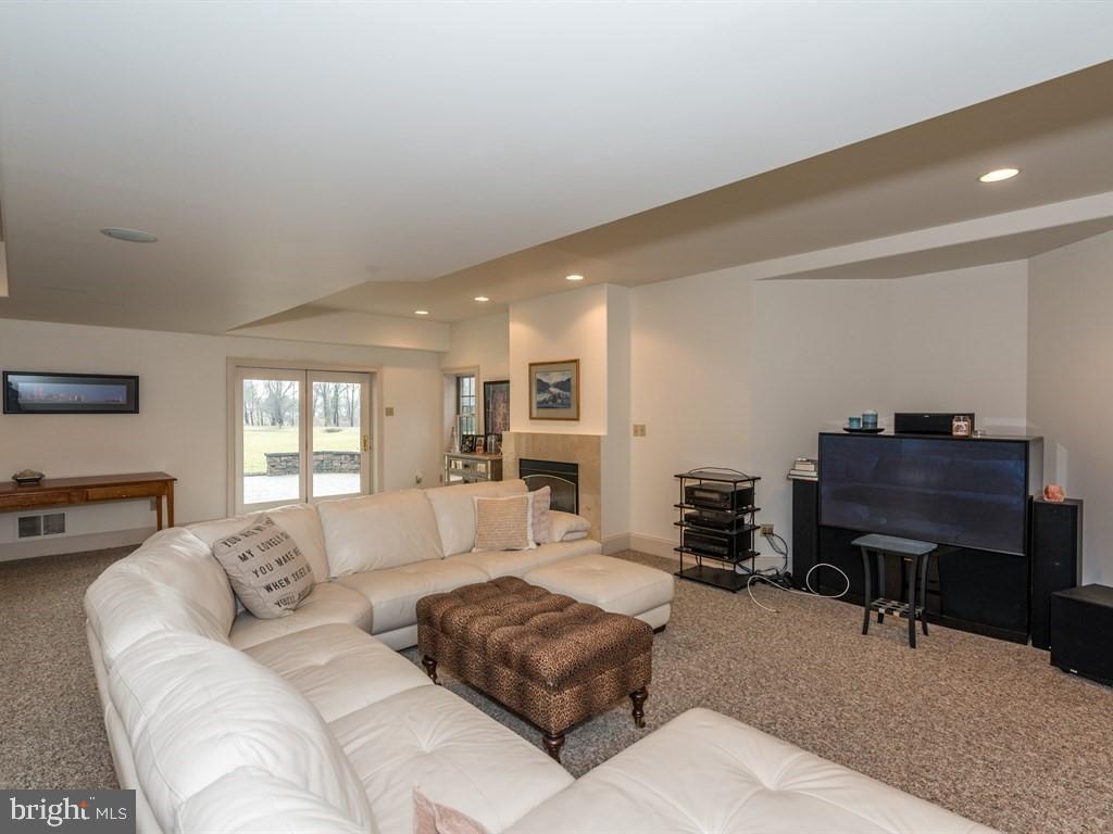 785 Rohen Ridge Drive Lititz, PA 17543 - Photo 29 of 36 a living room with furniture a piano and a flat screen tv
