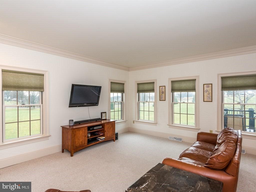 785 Rohen Ridge Drive Lititz, PA 17543 - Photo 10 of 36 a living room with furniture and a flat screen tv