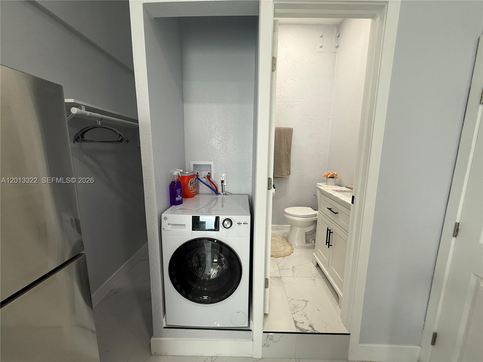 13204 Southwest 228th Street, Unit A Miami, FL 33170 - Photo 6 of 8 a utility room with dryer and washer