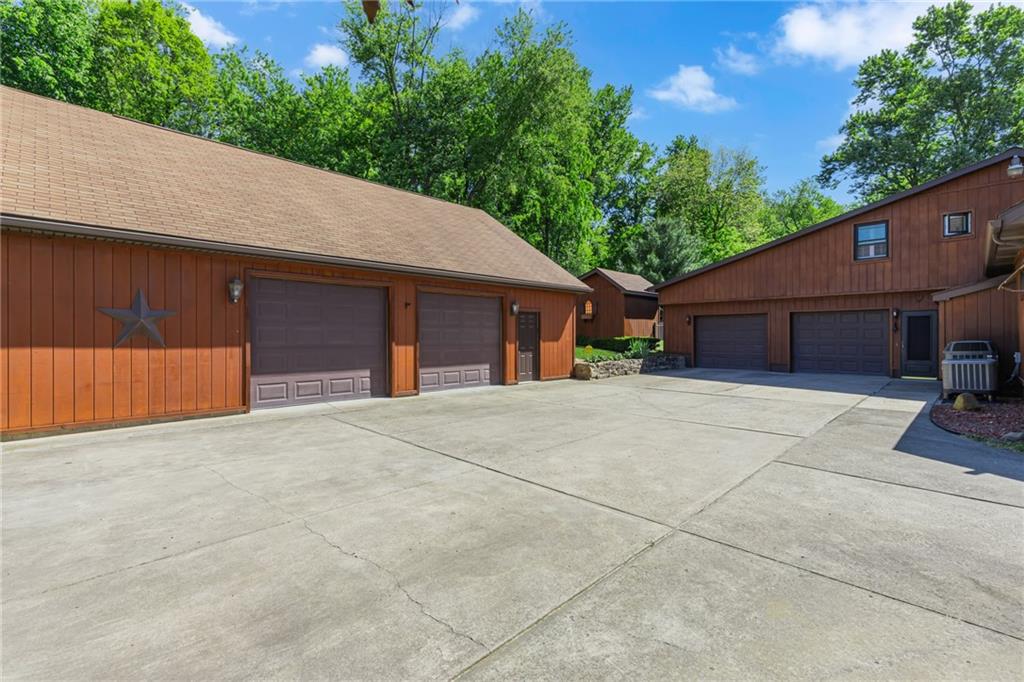 2085 Frew Mill Road New Castle, PA 16101 - Photo 38 of 49 A two-car attached garage and large detached two-car garage offer plenty of space for vehicles, storage, hobbies, or a workshop.